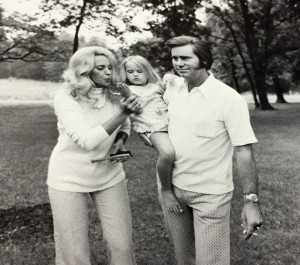 Image of Tammy Wynette and George Jones with small girl, 1975