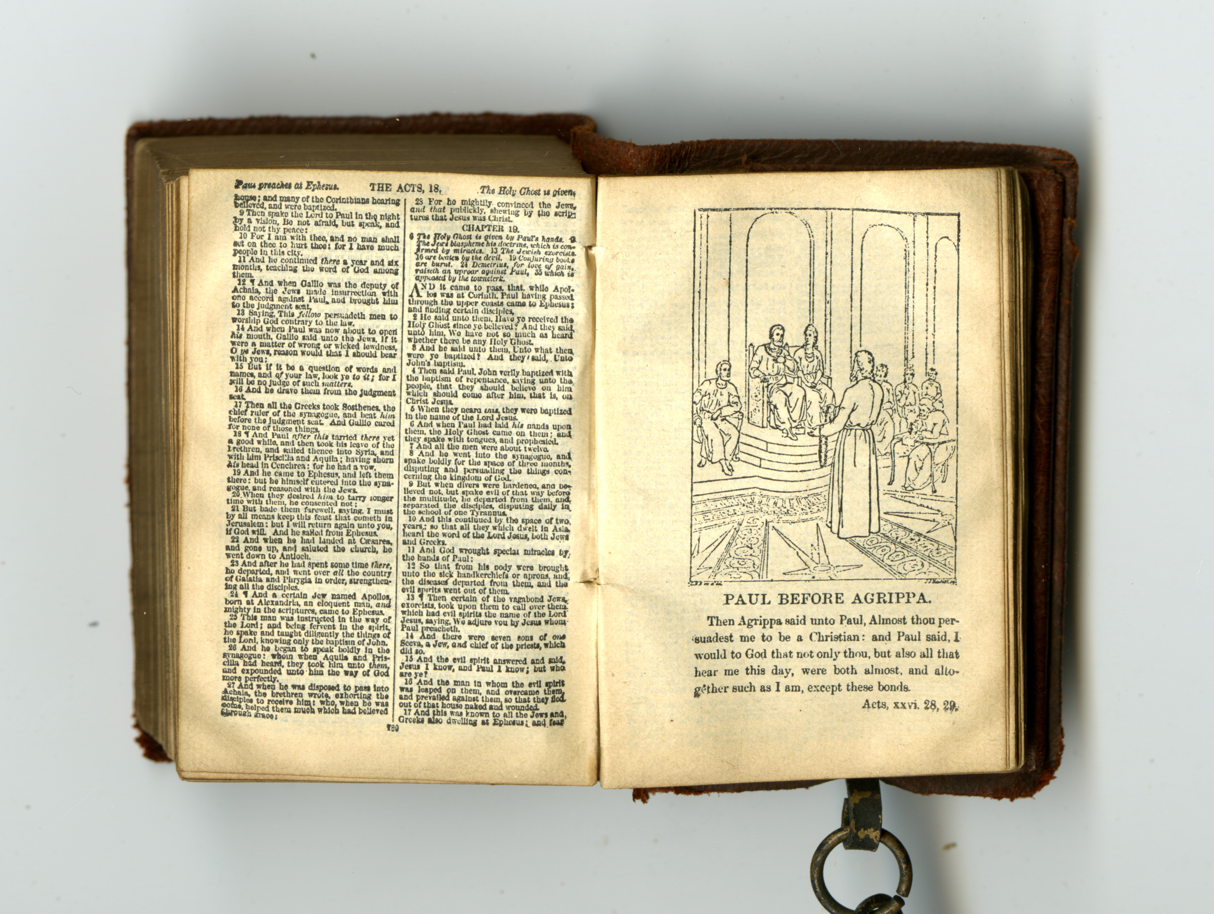 Page from Acts, featuring illustration of Paul, from miniature Bible, published in Glasgow by David Bryce in 1901, attached to miniature lectern by a chain