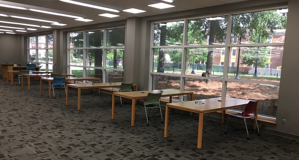 Library tables with chairs spaced for social distancing